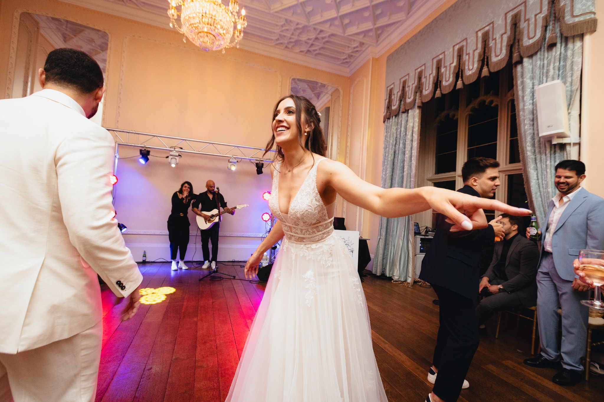 Live music building energy on the dancefloor at an Azoos Events wedding